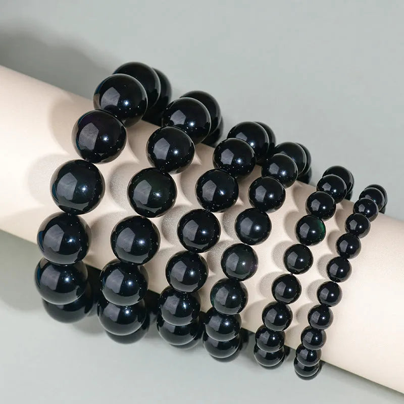 Hand-woven obsidian couples bracelet with year of birth engraving and multiple bead diameter options