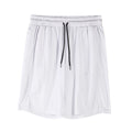 Man wearing black loose-fit quick-dry mesh Capri shorts for summer fitness.