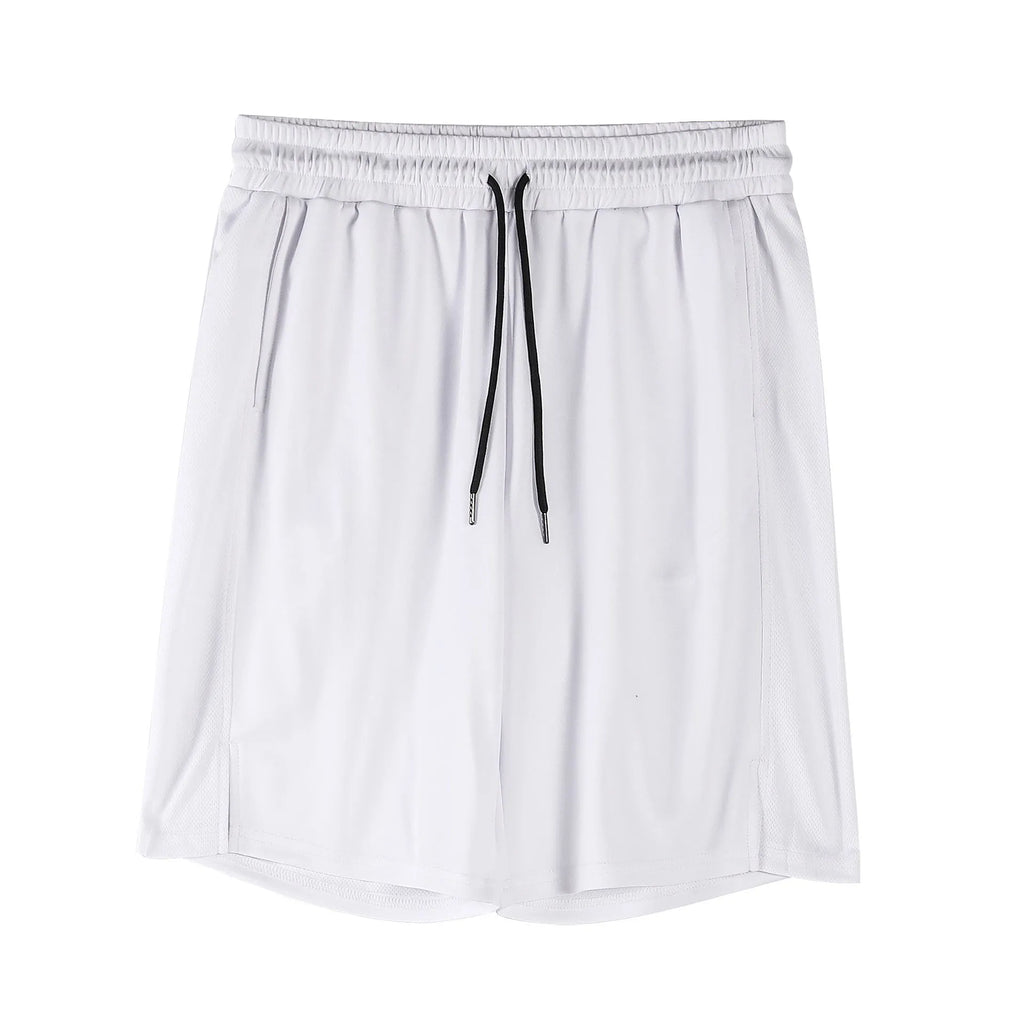 Man wearing black loose-fit quick-dry mesh capri shorts for summer sports.