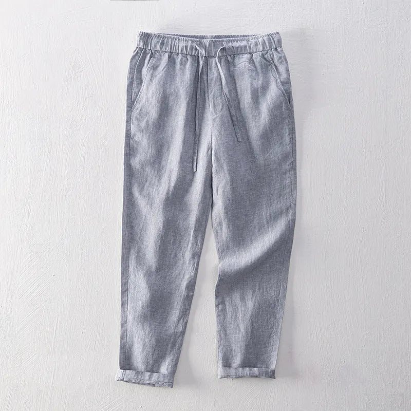 Men's straight-leg linen trousers in a mid waist cut, shown in a neutral colour.
