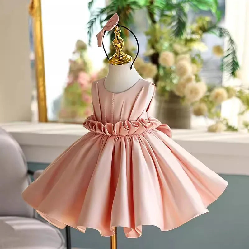 Children's princess dress in flesh pink polyester for piano performance with full skirt and fitted bodice