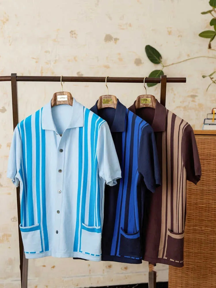 A striped knitted cardigan polo shirt with short sleeves and a lapel collar, shown in a light blue colour.