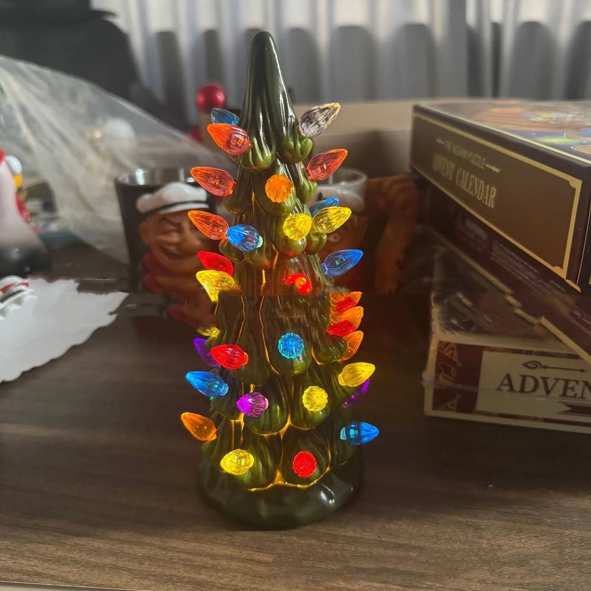 Set of three resin Christmas tree decorations in 20cm, 25cm, and 30cm sizes with LED lights.