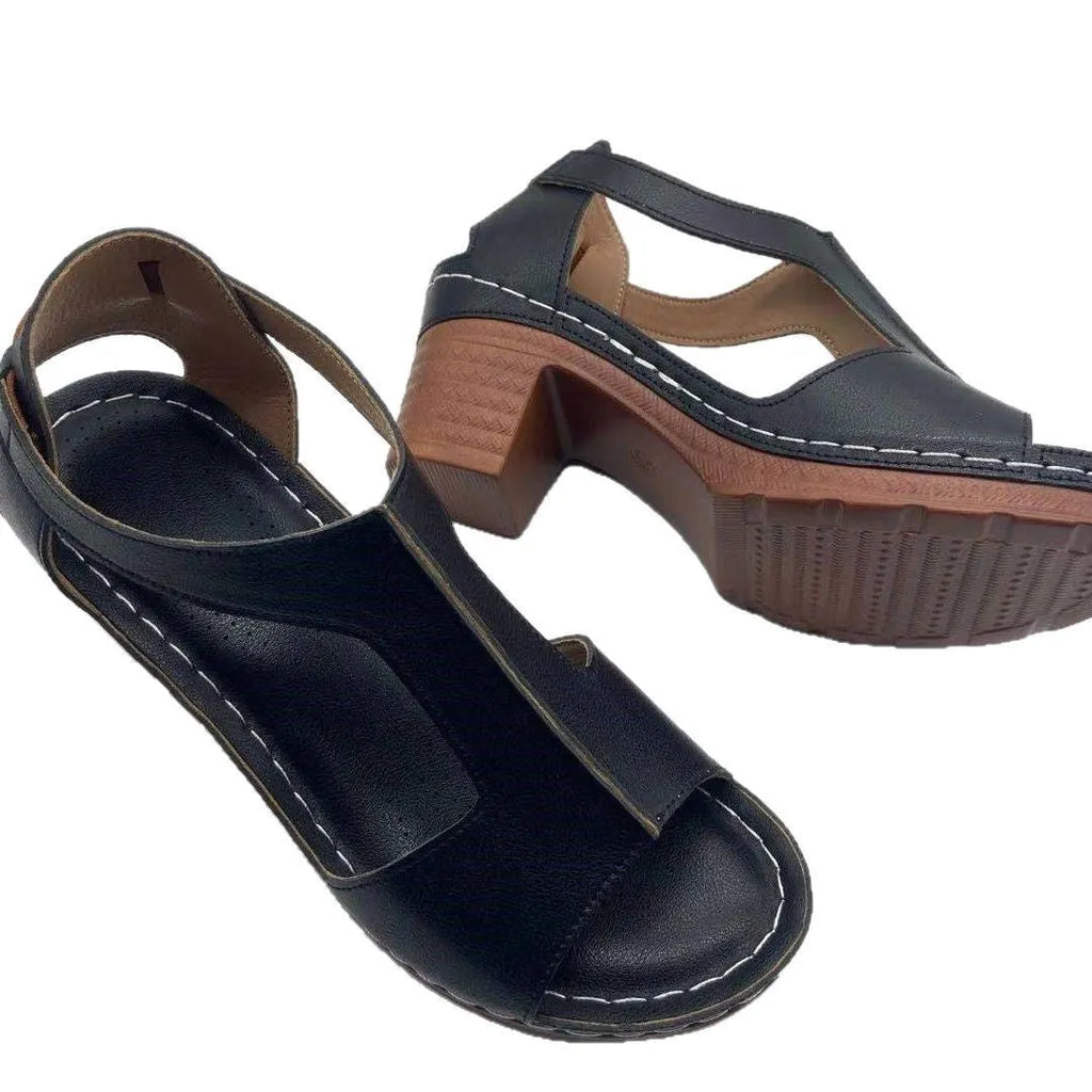 Women's white peep toe wedge sandals with a buckle strap on a slingback heel.