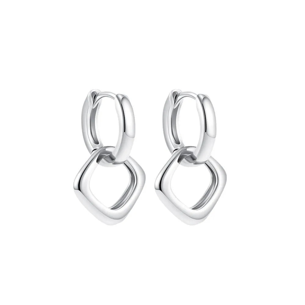 Copper geometric square double ring twist ear clip earrings on display