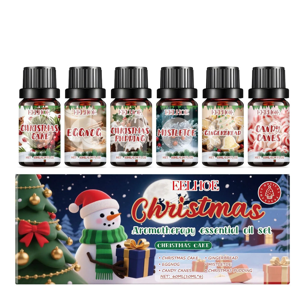 Box containing six small glass bottles of Christmas-themed aromatherapy oils.