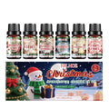 Box containing six small glass bottles of Christmas-themed aromatherapy oils.