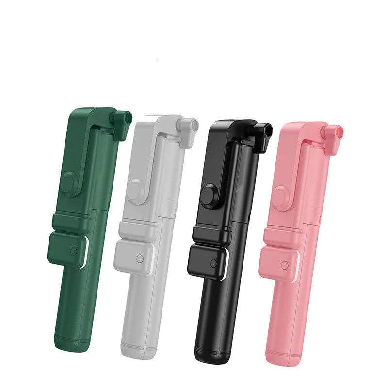 Black Bluetooth selfie stick with fill light and extended tripod legs holding a smartphone.