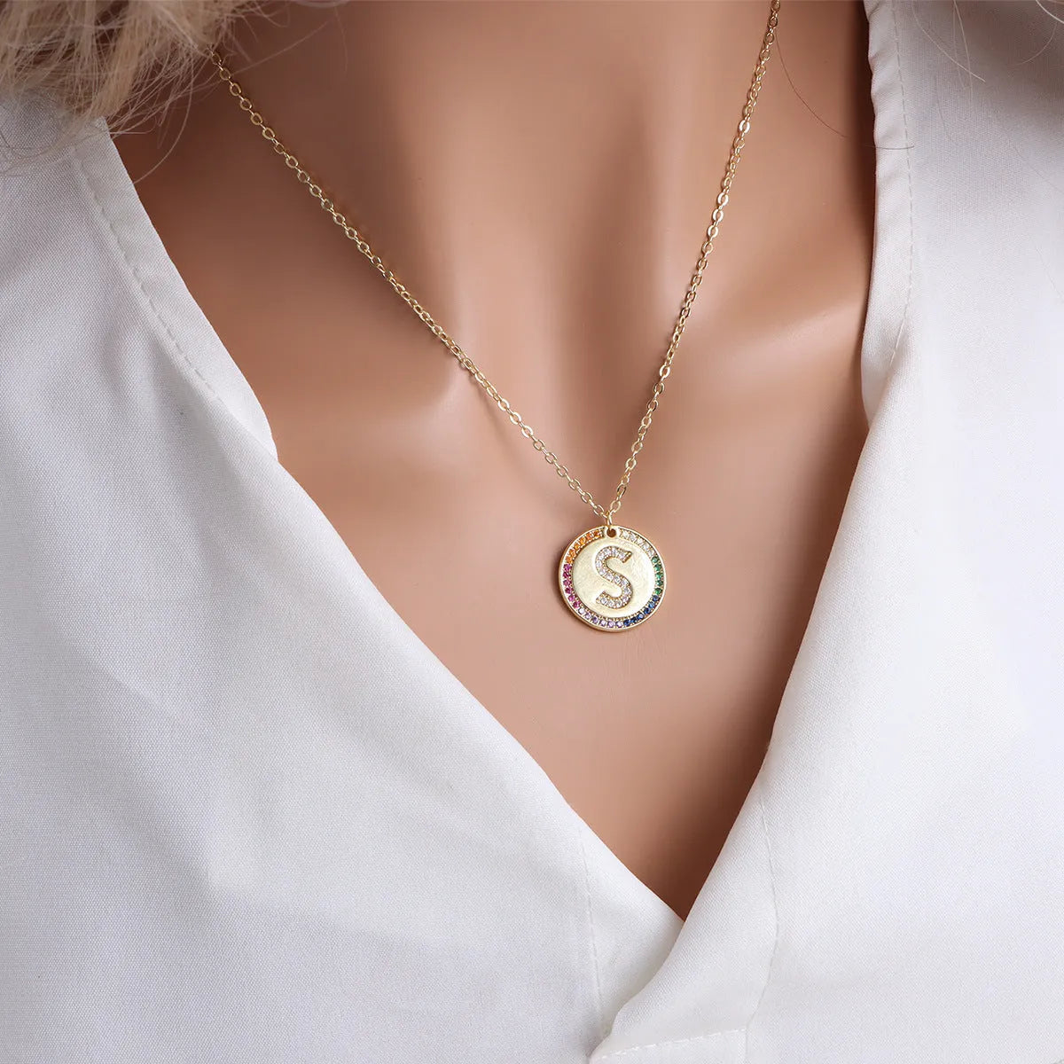 Gold English letter round pendant necklace with colourful crystals on clavicle length chain