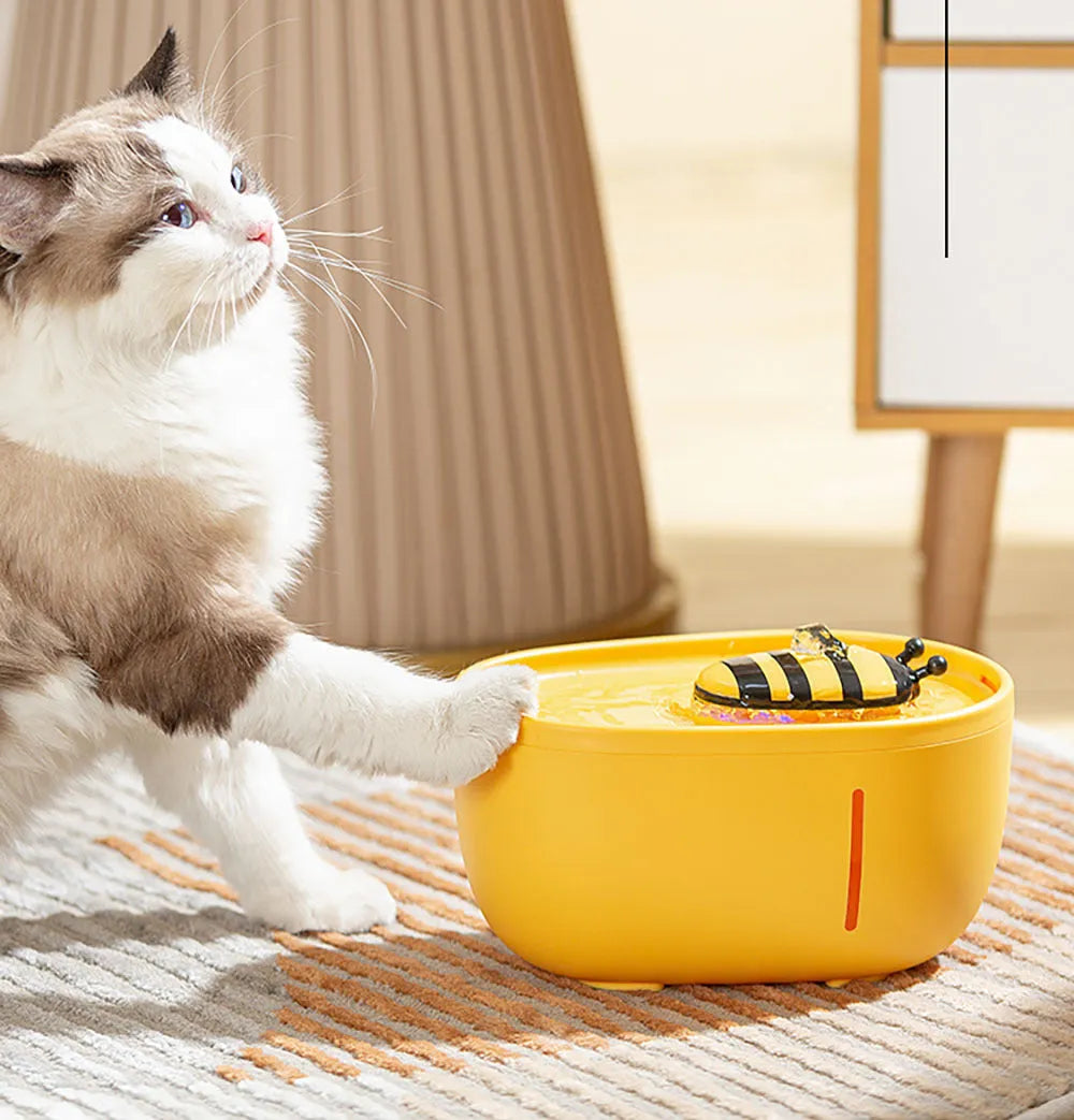 Yellow cat water fountain with filter system and blue LED light indicator