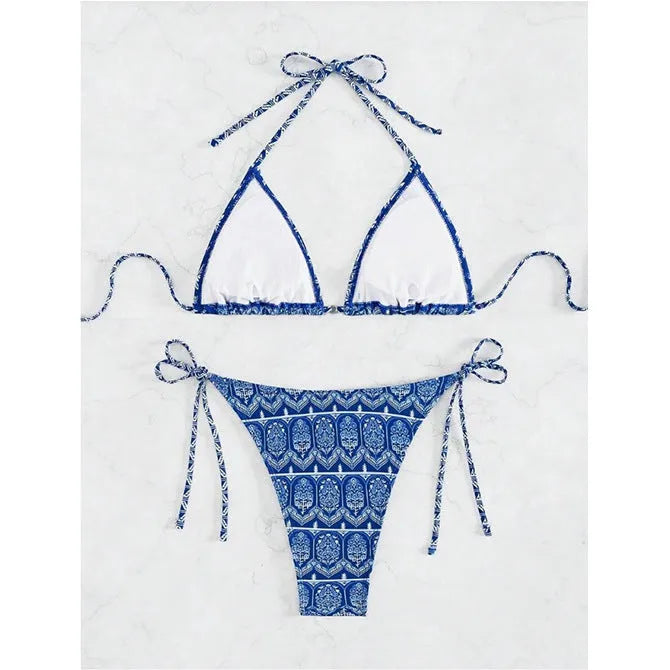 Women's green split bandage bikini with printed stitching on a mannequin.