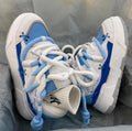 Women's grey retro chunky platform sneakers with thick rubber sole and lace-up front