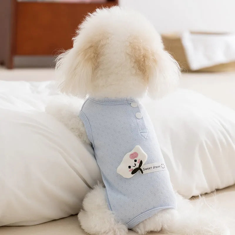 Soft yellow mesh pet shirt with cartoon cat patch and button closure on a small dog or cat
