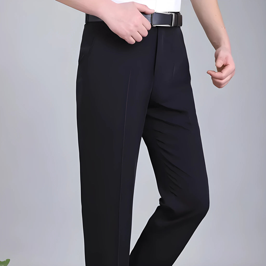 Men's dark blue straight-leg suit trousers with a high waist and non-iron finish on a hanger.