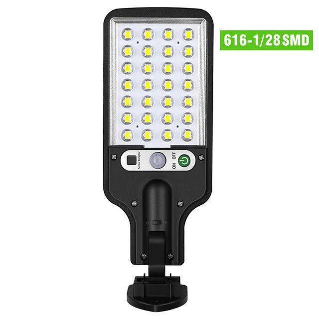 Outdoor solar LED wall lamp 28LED variant mounted on a garden fence for patio lighting