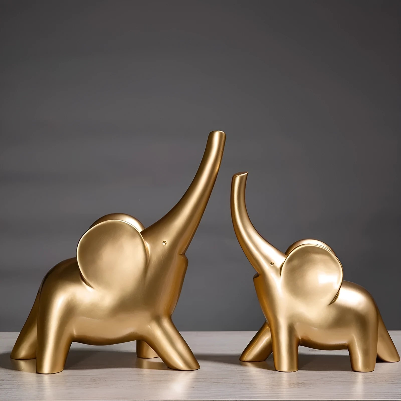 Modern minimalist resin elephant ornament in rose gold or white colour, available in large and small sizes.