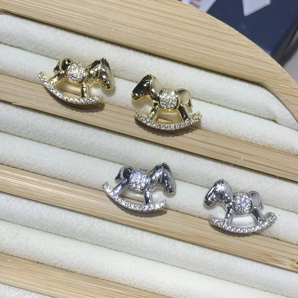 Diamond studded rocking horse earrings in gold and silvery metal finish for women
