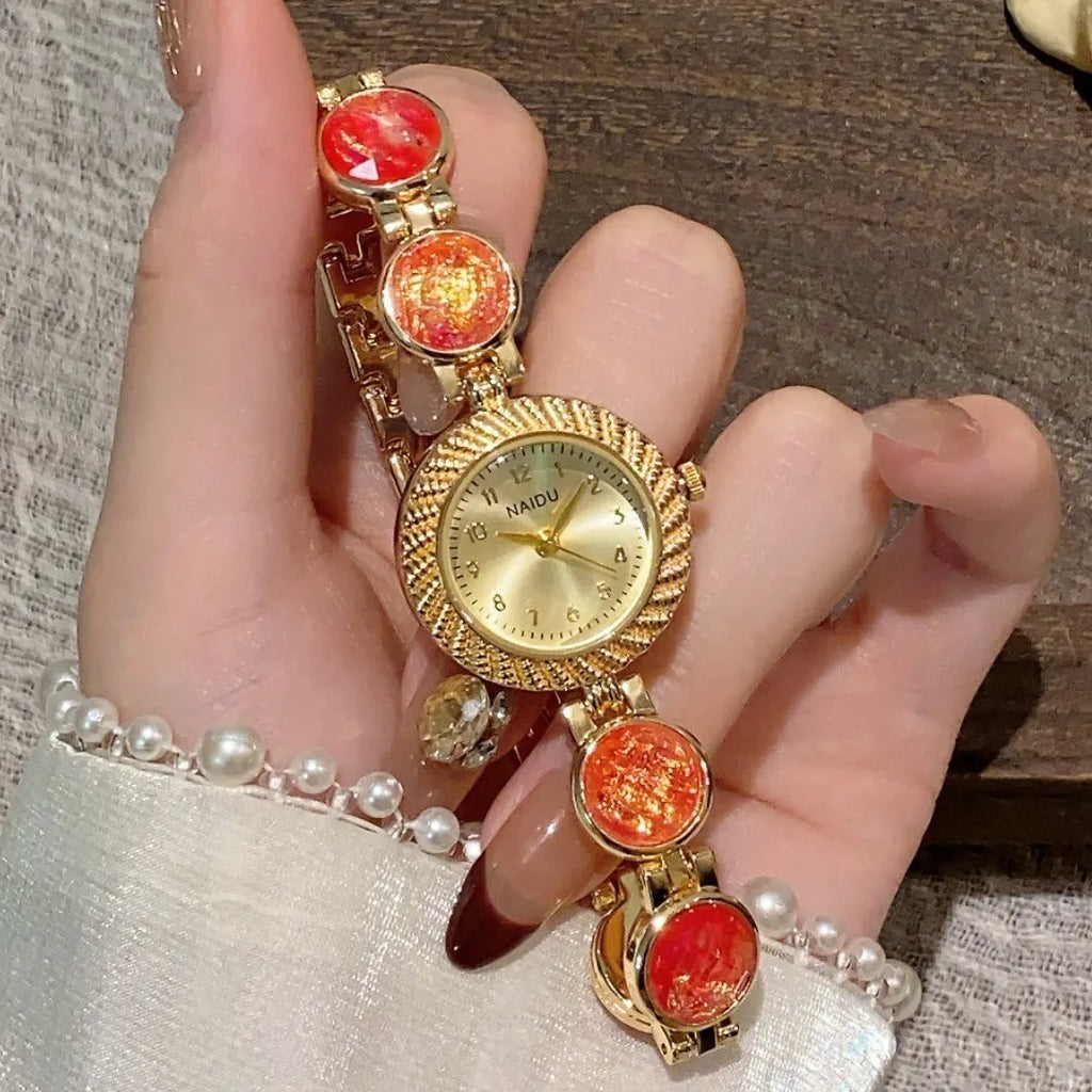 Women's quartz watch with round 25mm dial in one of six colour options on a wrist