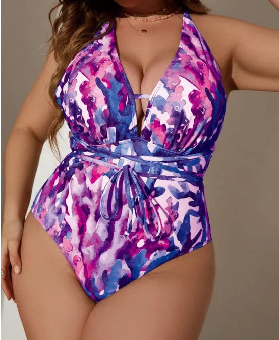 Solid purple women's one-piece halter swimsuit with brief style on a mannequin