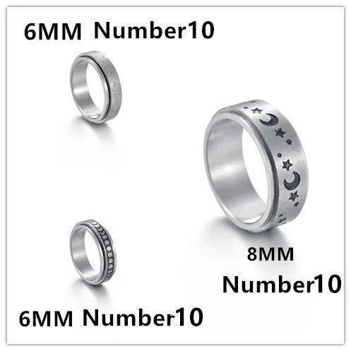 Titanium steel star moon ring in glossy finish on a neutral background, showing celestial motif and band width