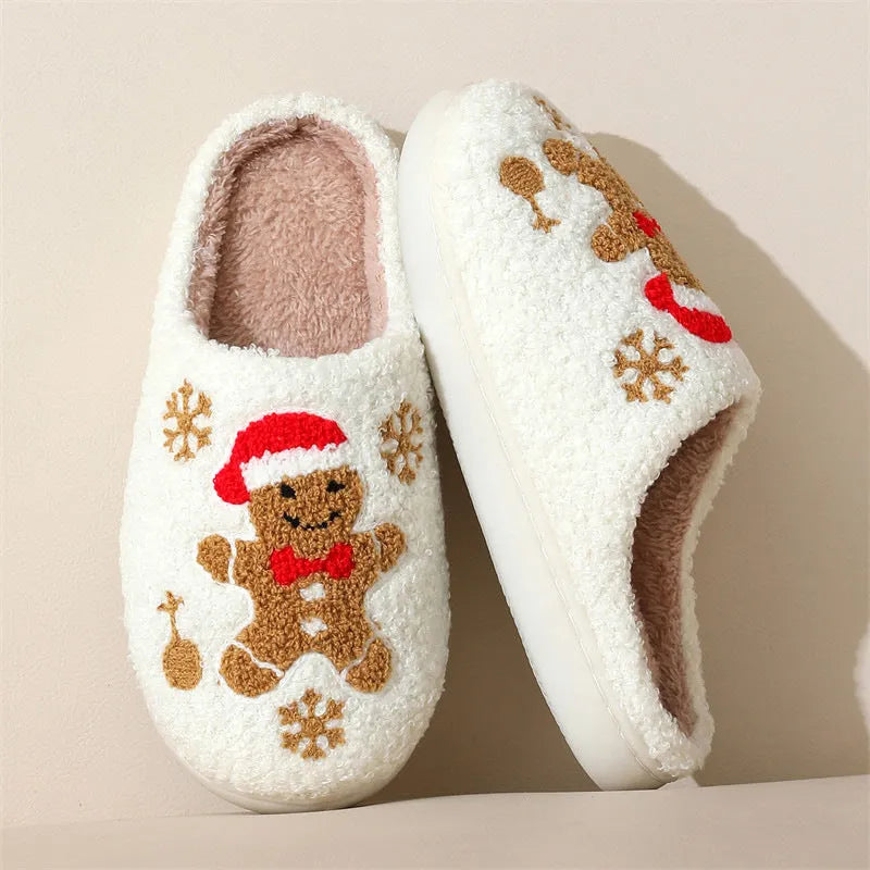 Christmas snowflake gingerbread pattern slippers with plush upper and TPR sole on a wooden floor