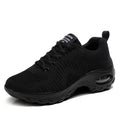 Women's low-top black mesh sneakers with white laces and a 3-5cm heel on a grey background.