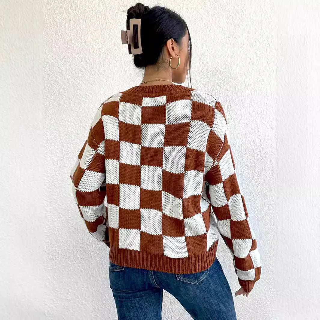 Dark brown plaid pattern acrylic pullover sweater with long sleeves and a round neck.