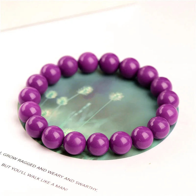 Single-strand Jiuya crystal bracelet in translucent purple mica with polished 8mm beads.
