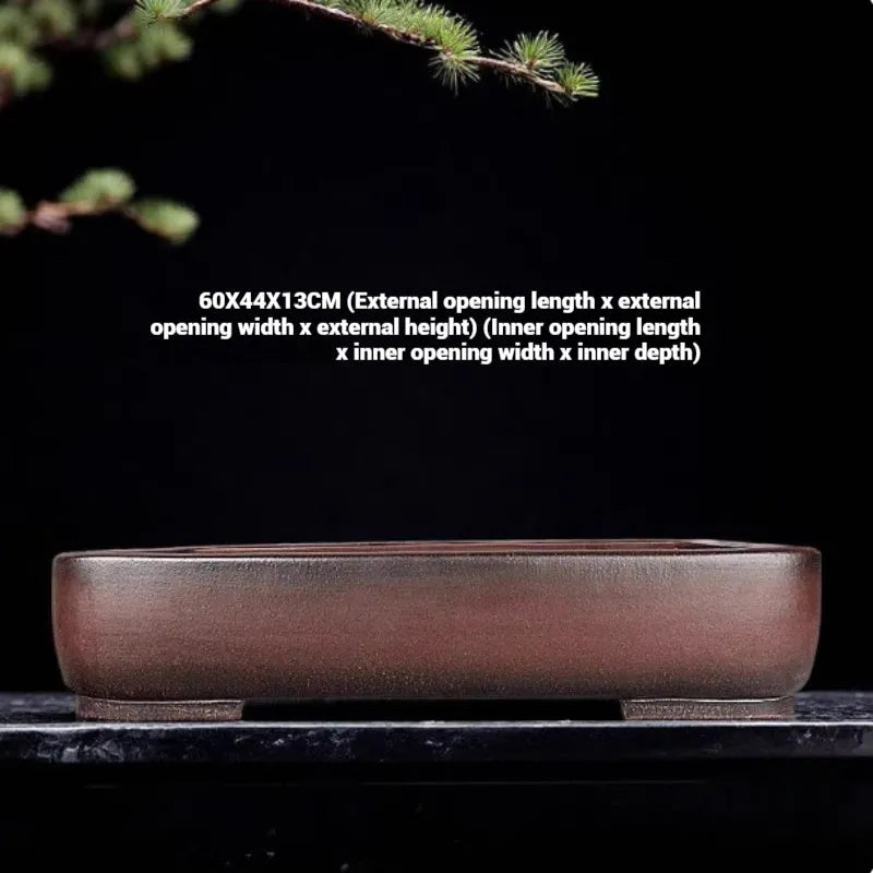 Handmade antique rectangular purple clay flower pot showing its size and shape.