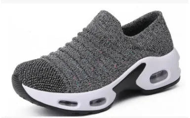 Women's plus size fly-knit socks shoes in stretch mesh with low heel and round toe.