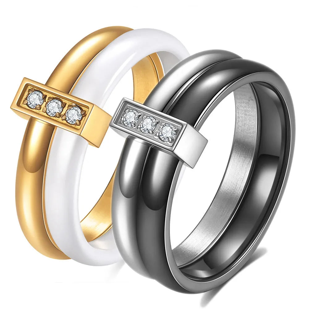 Steel black zirconium ceramic women's ring with 6mm wide band and glossy round inlay detail on a finger.