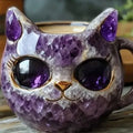 Purple geode mug with crystal cat design and colourful resin interior on a wooden surface.