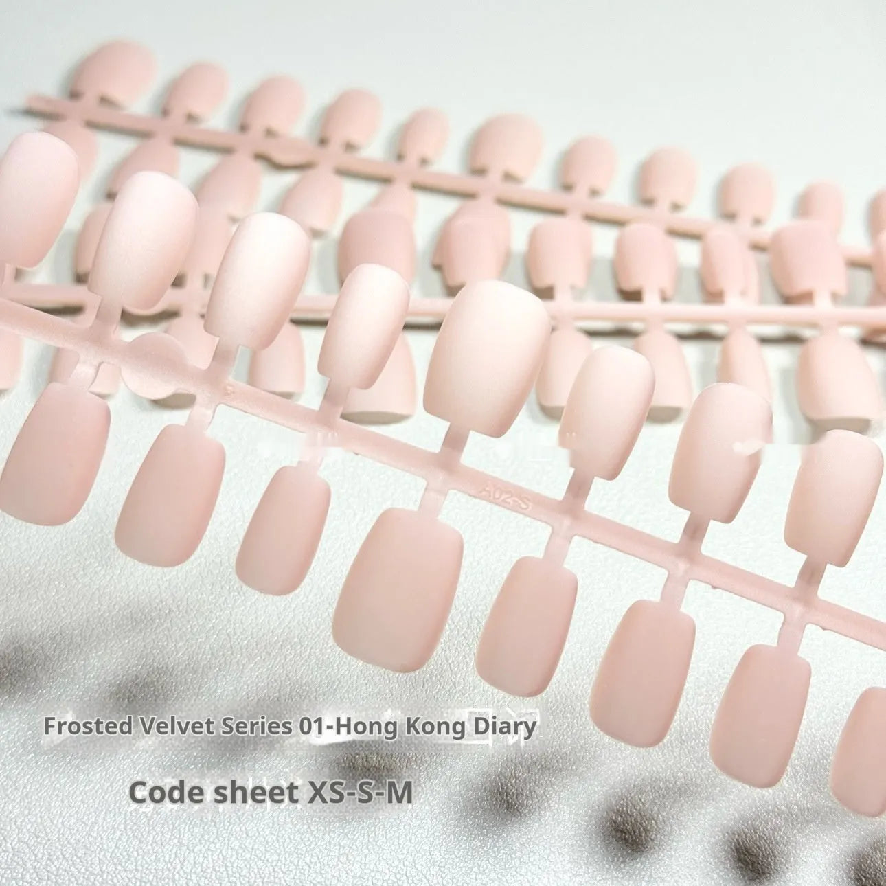 Frosted velvet Cat's Eye effect nail wraps showing aurora armour style on a hand, with short ladder XS, S, M sizing options.