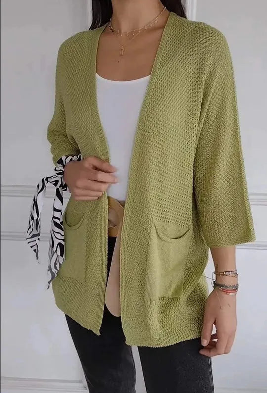 Women's waffle-textured cardigan coat in army green with nine-quarter sleeves and pockets.