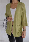 Women's waffle-textured cardigan coat in army green with nine-quarter sleeves and pockets.
