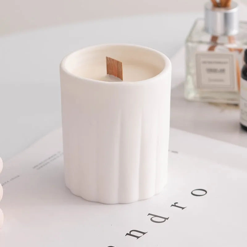 Minimalist ceramic round candlestick with relief pattern on a dining table