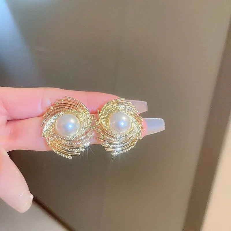 Women's vintage pearl earrings with flower-shaped alloy design and irregular hand-finished elements