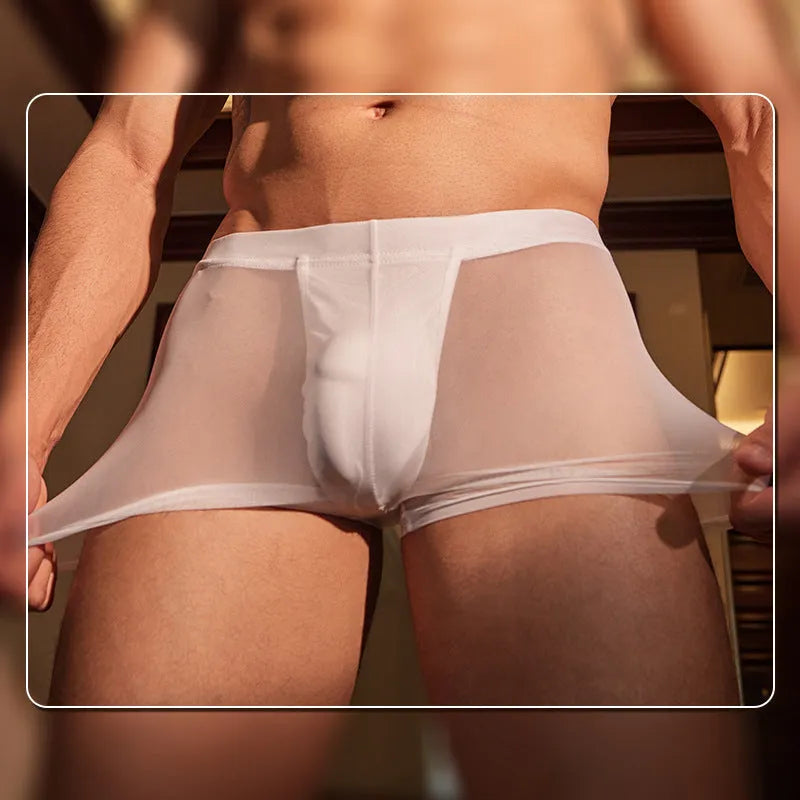 Men's black and white breathable nylon boxer briefs laid flat, showing ultra-thin fabric.