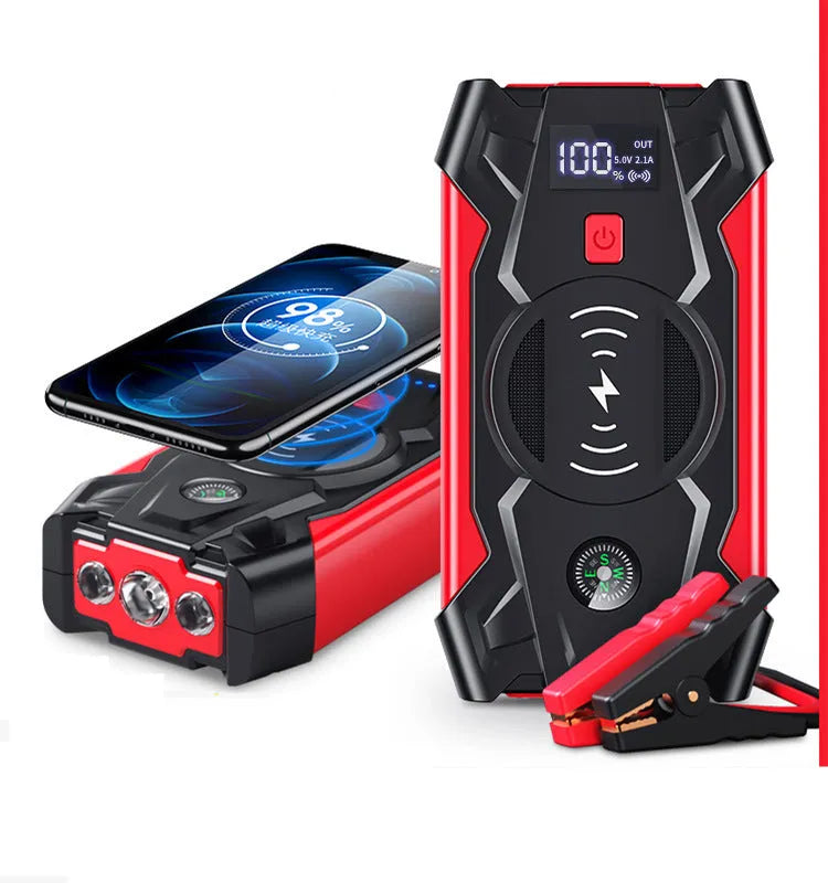 Red portable car battery jump starter with digital display, crocodile clips, and air pump hose.