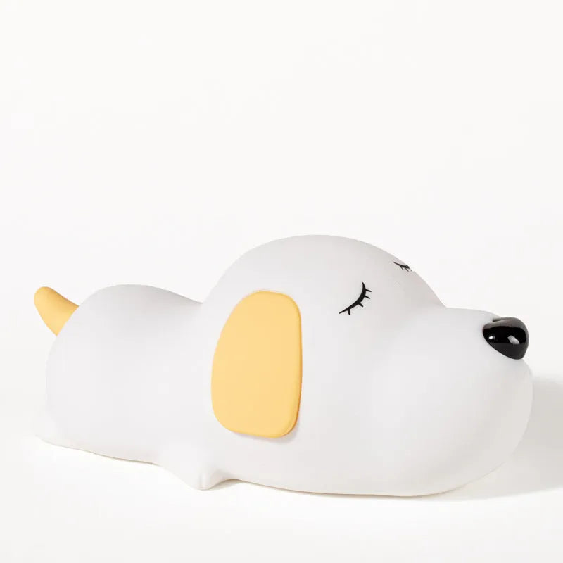Cute silicone dog night lamp with two-color USB charging light on a wooden table