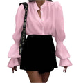 Women's polyester shirt with lantern sleeves, ruffle detail, round neck, single-breasted front, in white, pink, or black.