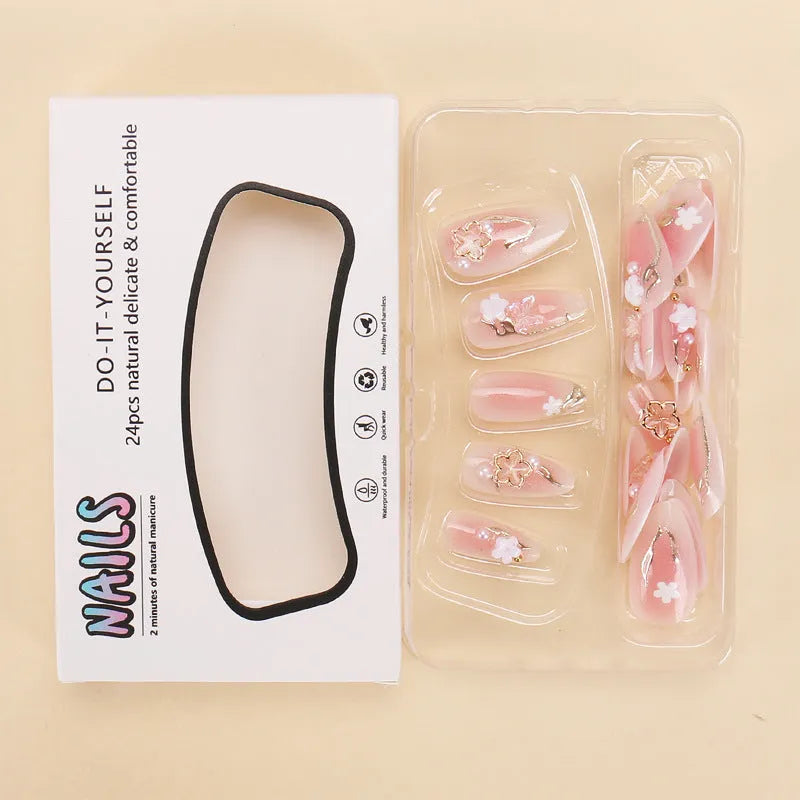 Gold silk butterfly nail tips with flower patterns and gradient gilding in medium drop shape
