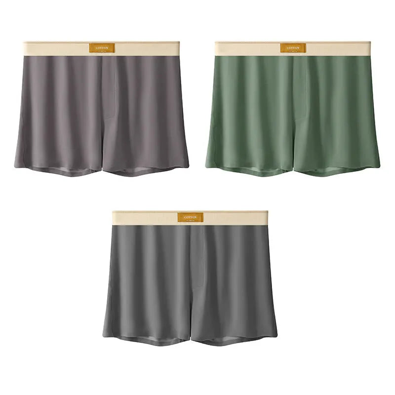 Pack of men's solid colour ice silk boxer shorts showing loose fit and mid-waist design.