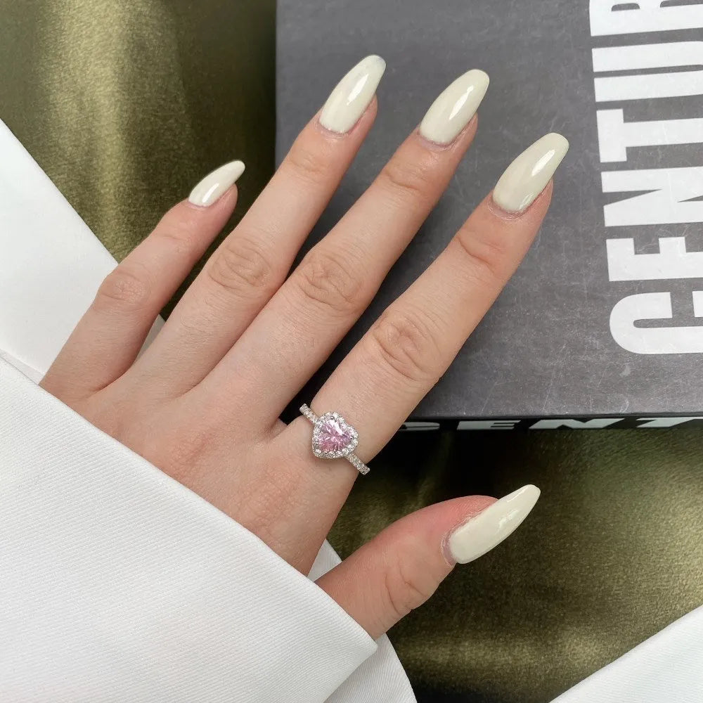 Women's S925 sterling silver heart-shaped ring in white diamond electroplated finish on white background