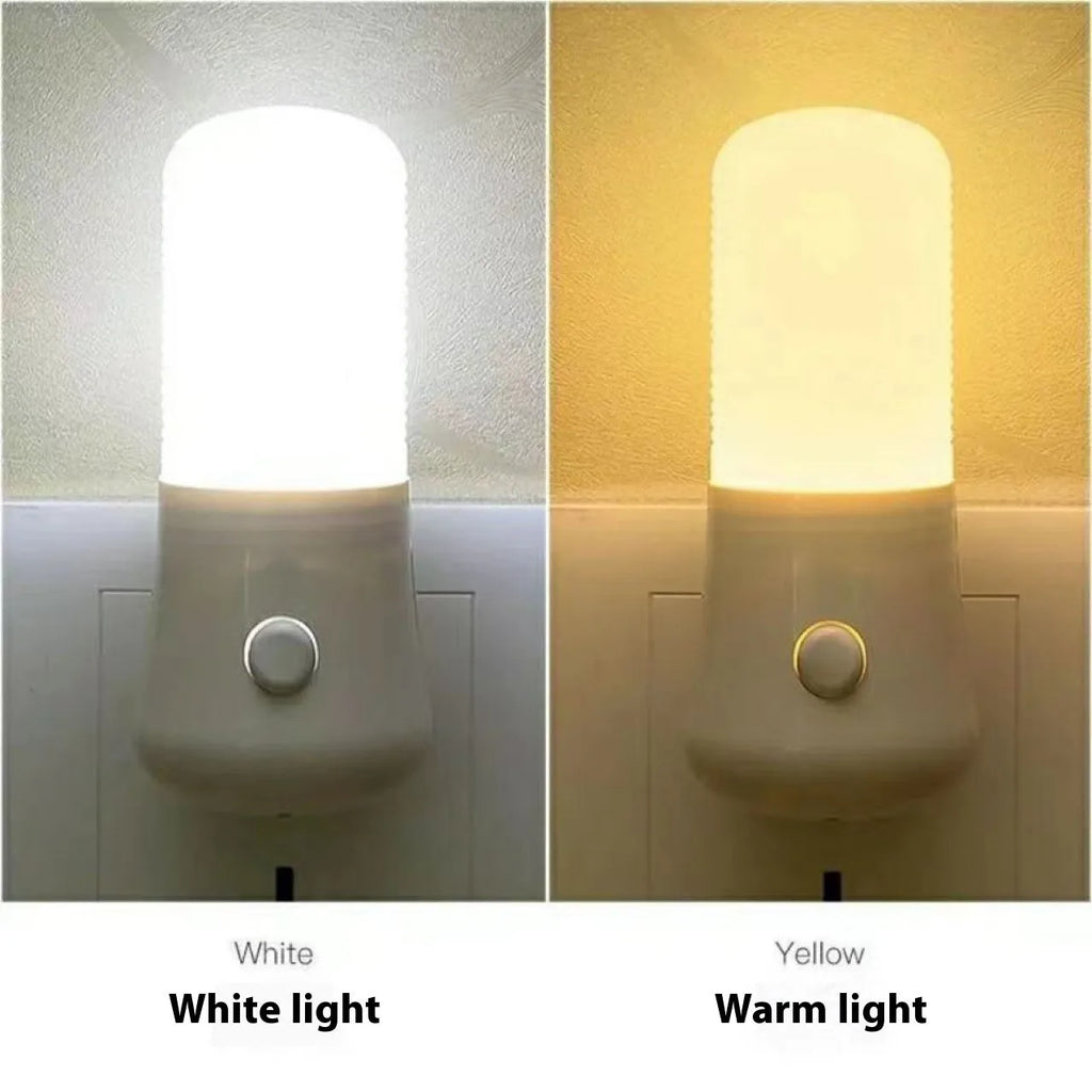 White minimalist plug-in bedside night light with dual colour switch showing 6.5cm cube dimensions