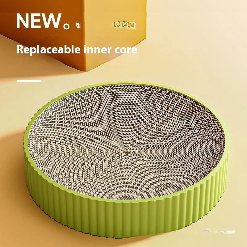 Green and white round cat scratching board with replaceable corrugated paper panels measuring 55 cm