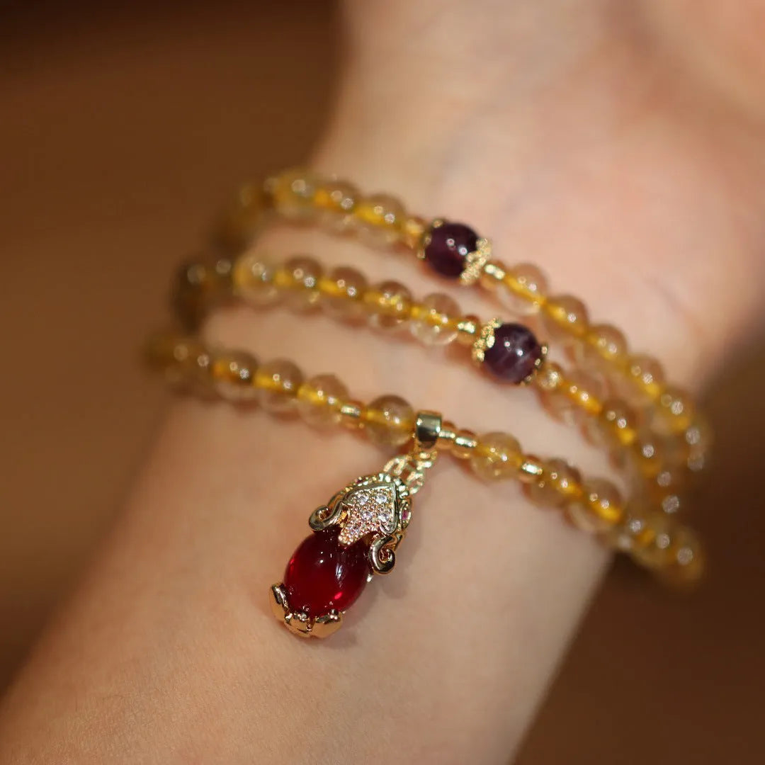 Natural Brazil gold rutilated quartz bracelet with three circular accents and Chinese-style hanging chopsticks design