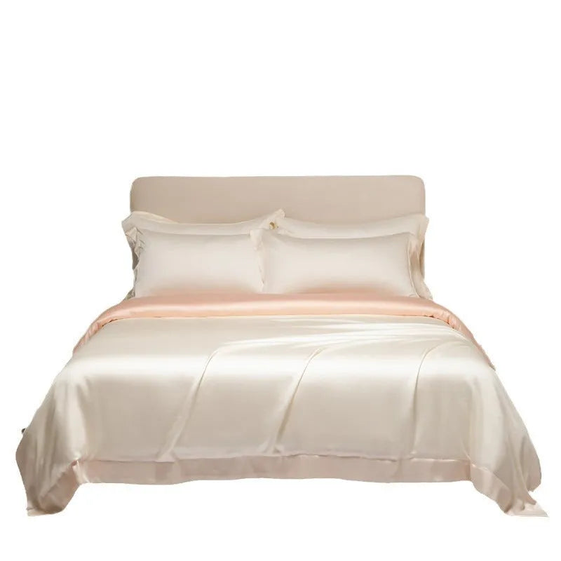 A modern, neatly made bed with a Lenzing Tencel duvet cover and pillowcases in a choice of nine colours like Sea Salt Blue.