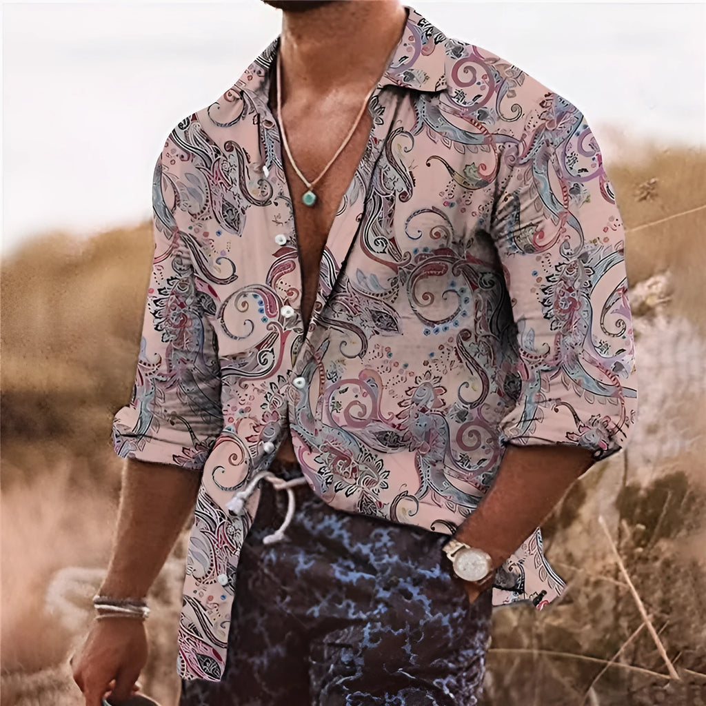 Man wearing a loose-fit long sleeve shirt with a detailed 3D floral print in a bohemian style.