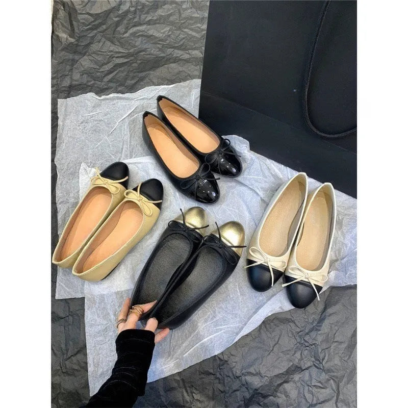 Women's apricot colour ballet flat pumps with a round toe and flat rubber sole.